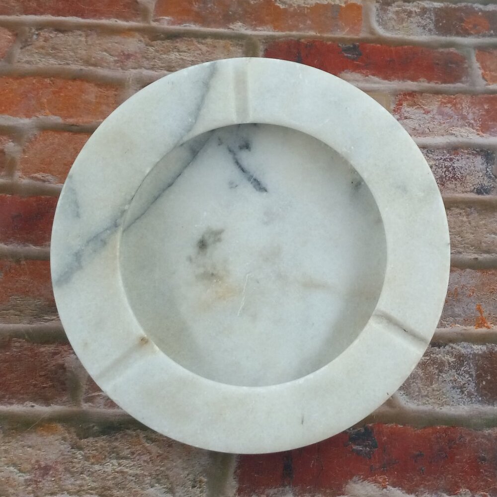 Six inch white marble ash tray.